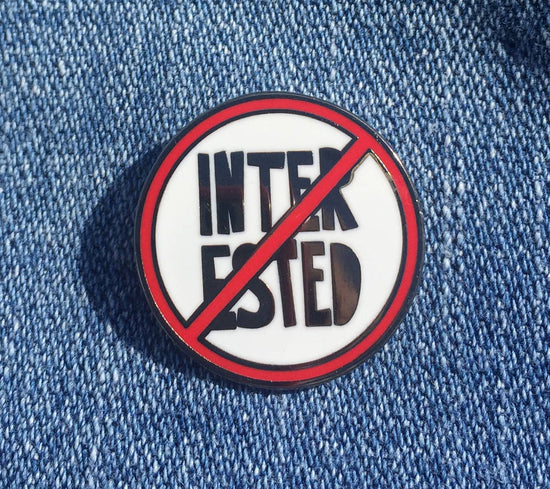 Not Interested - enamel pin